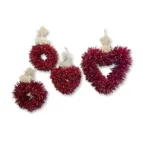 Decorative piquin chile wreaths on a white background