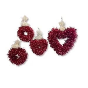 Decorative piquin chile wreaths on a white background