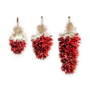 Three piquin chile ristras on a white background